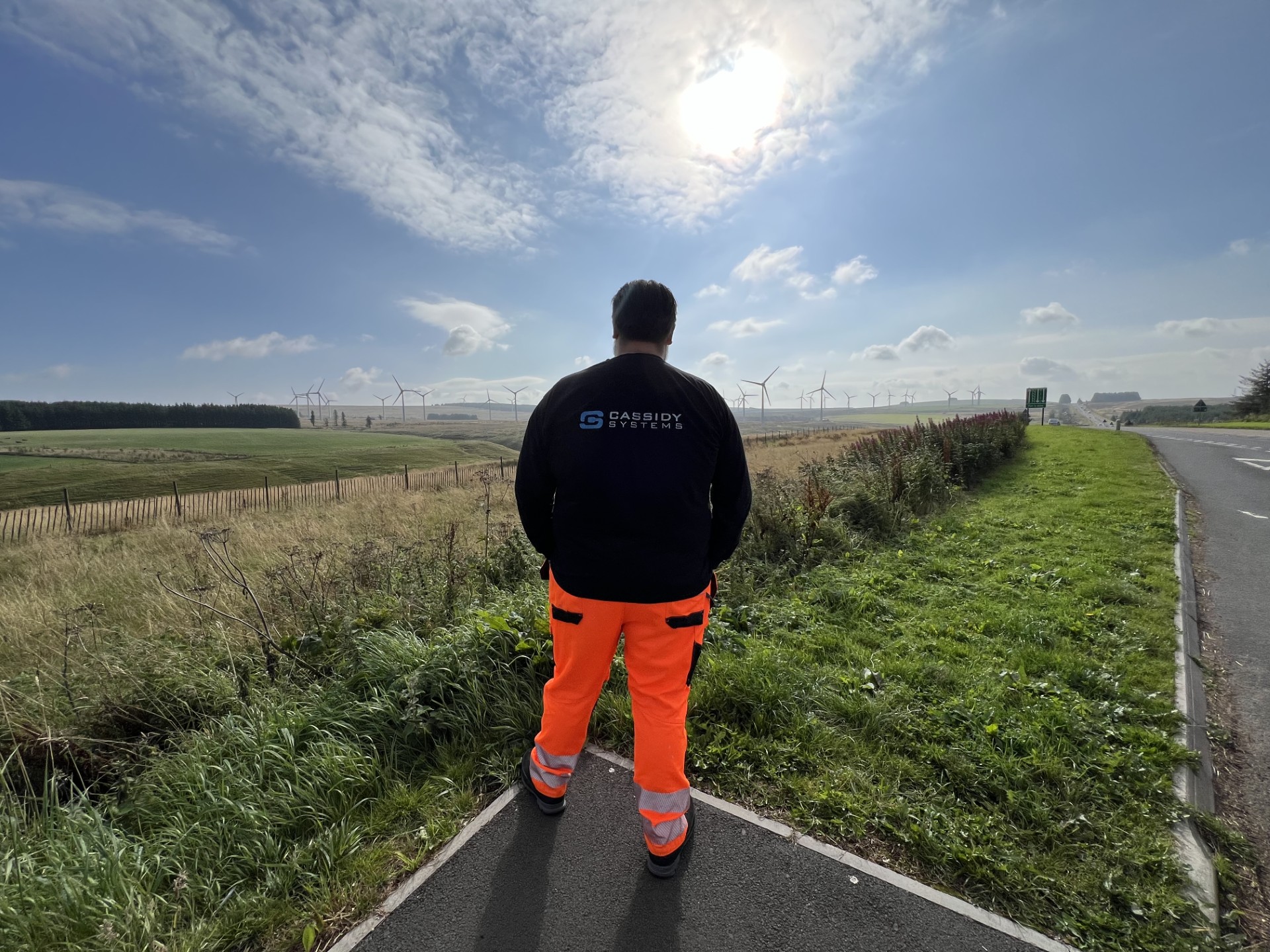 Cassidy Systems Engineer Viewing Wind Farm